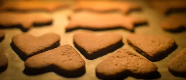 Heart shaped gingerbread cookies in the oven.