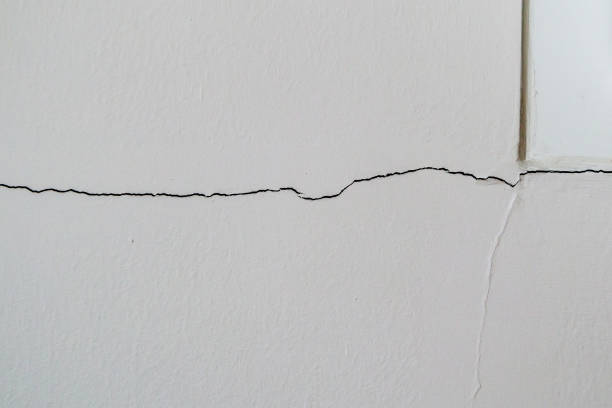 New house wall crack near window frame