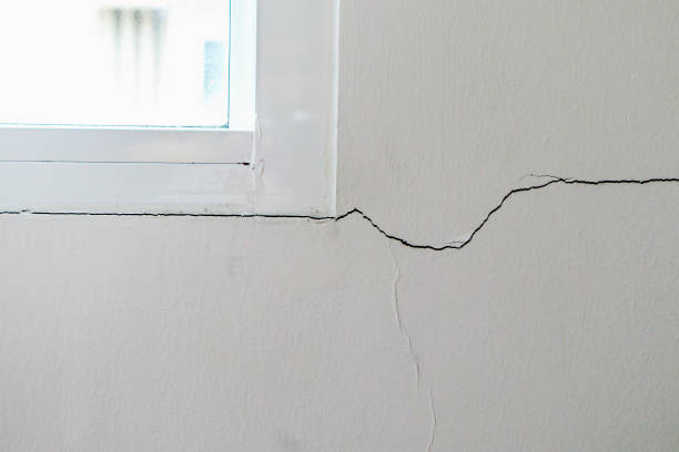 istock New house wall crack near window frame 1082029180