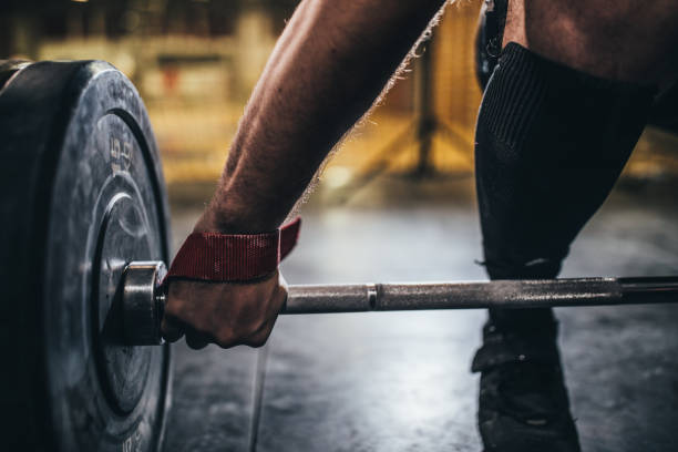 istock Muscular man deadlifting barbell 1082031478