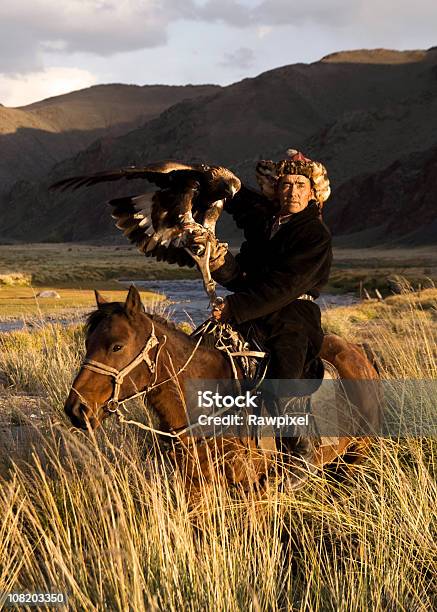 Mongolian Man With Trained Eagle Stock Photo - Download Image Now - Independent Mongolia, Kazakhstan, People