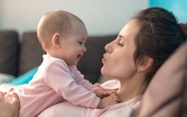 mother playing with her baby