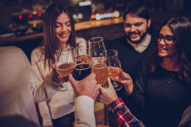 istock Happy friends drinking beer in pub 1082036454