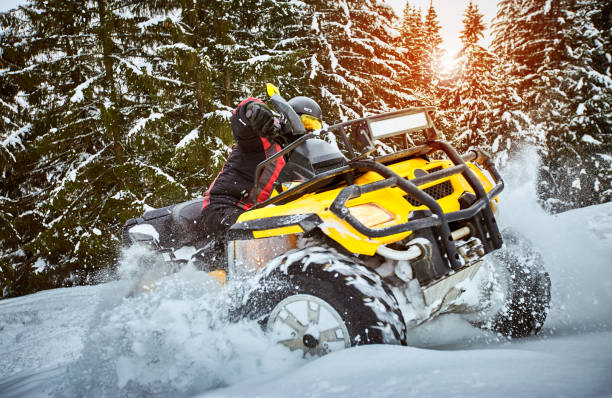 istock Winter race on an ATV on snow in the forest. 1082036636