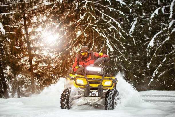 istock Winter race on an ATV on snow in the forest. 1082036640