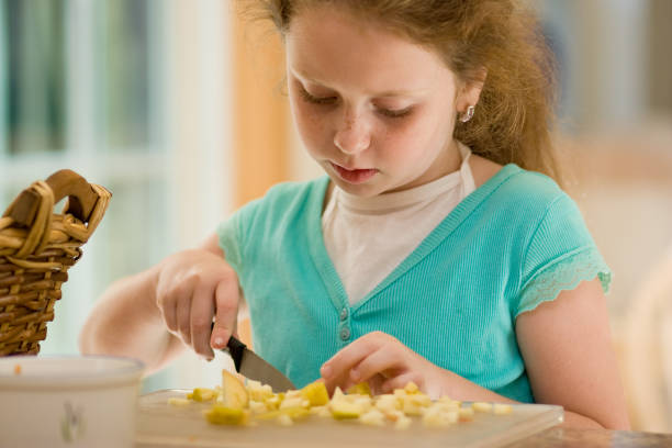 istock Little girl cook the fruit salad 108203766