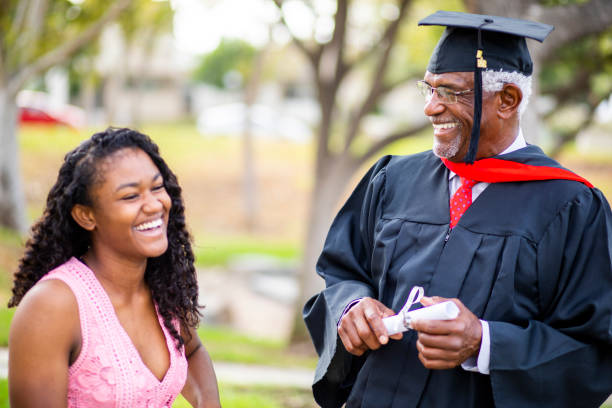 istock Senior black man at graduation with his daughter 1082037980
