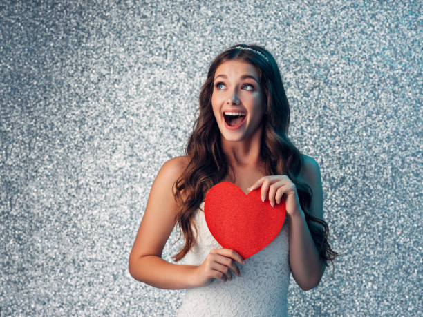 istock Beautiful woman with heart symbol 1082038764