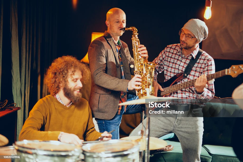 Practicing Instruments Group Band Practicing For The Gig Stock Photo - Download Image Now ...