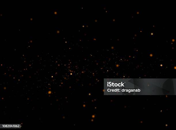 Golden Sparkles At Night Stock Photo - Download Image Now - Sparks, Glittering, Black Background