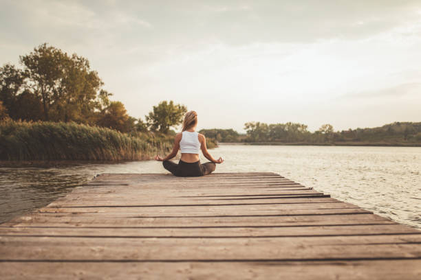 istock Woman doing yoga meditation 1082043838