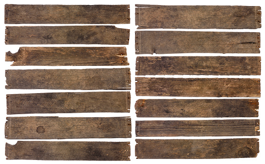 Old dirty wooden plank boards naturally weathered and stained isolated on white background.