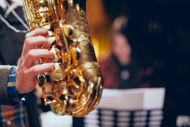 istock Close up of man playing saxophone. 1082046866