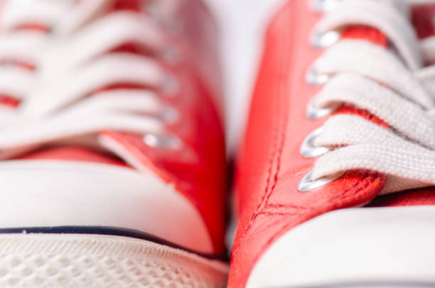 istock Red leather sneakers shoes laces macro 1082047060