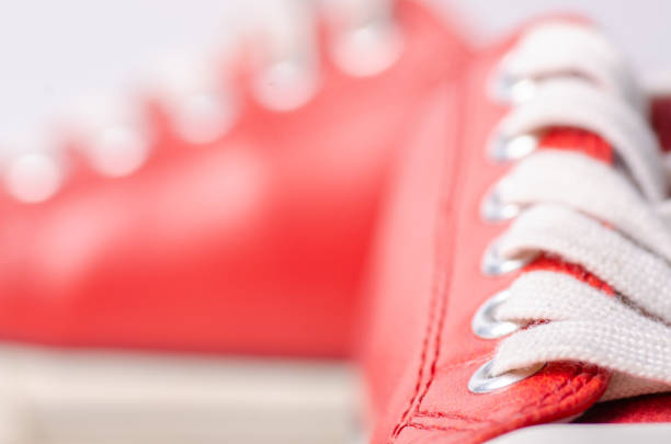 istock Red leather sneakers shoes laces macro 1082048946