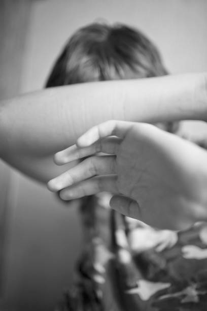 istock Teen boy protects himself with his hands from violence 1082049076