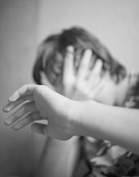 istock Teen boy protects himself with his hands from violence 1082049238