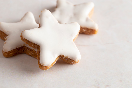 A Batch of Star Shaped Gingerbread Cookies with White Icing