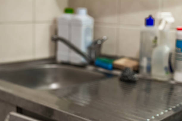 istock Blurred background of modern kitchen with tabletop and copy space 1082066732