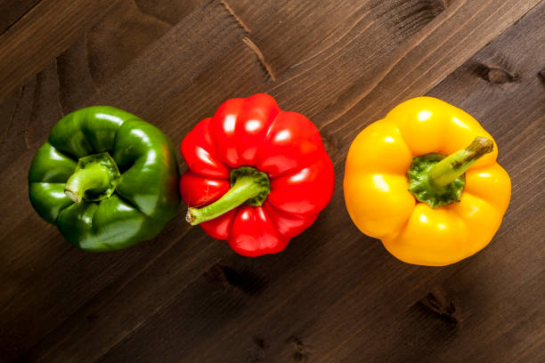 istock Bell peppers isolated on wooden surface 1082071922
