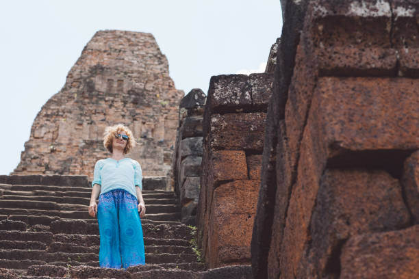 istock Low Angle View Of Woman Standing On Steps At Old Ruin 1082071968