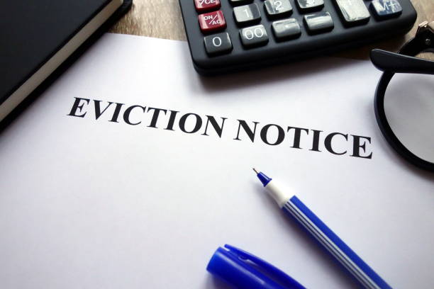 istock Eviction notice document, pen, glasses and calculator 1082072028