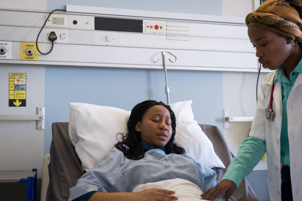 istock Doctor helps a patient who is in pain 1082072256