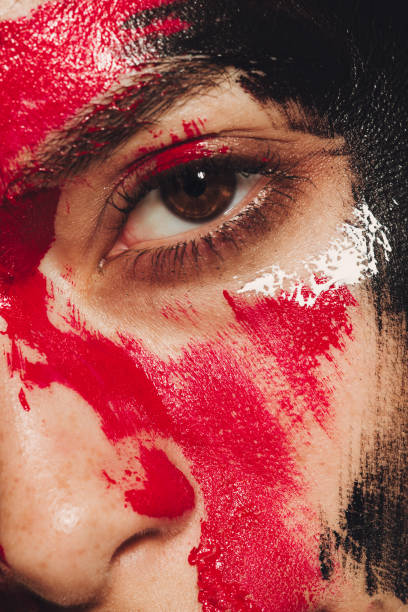 istock Colorful painting over the models face 1082077152