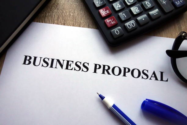 istock Business proposal document, pen, glasses and calculator 1082077454