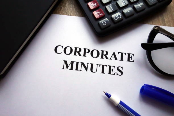 istock Corporate minutes document, pen, glasses and calculator 1082079536