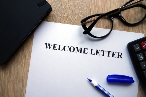 istock Welcome letter, pen, glasses and calculator 1082081404