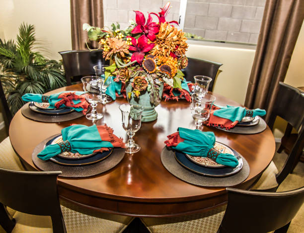 istock Six Place Settings On Round Wooden Dining Table 1082082098