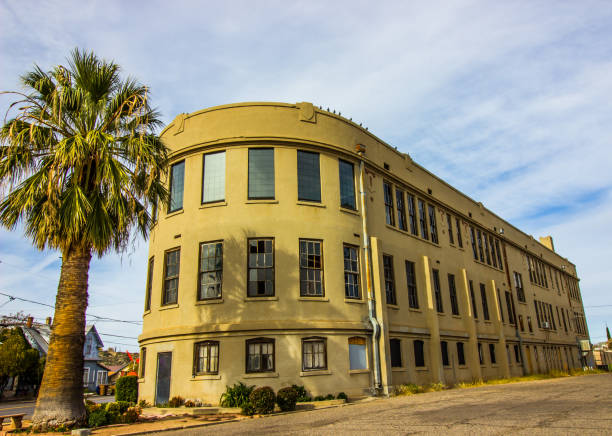 istock Vacant Three Story Building With Broken Windows 1082082266