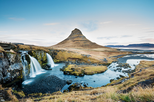 This is a photograph of the Kirkjufellfoss Waterfall and Kirkjufell Mountain in the Snaefellsness Peninsula of Iceland.