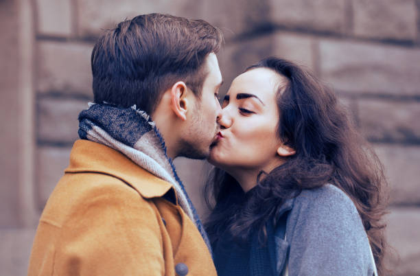 istock Young couple kissing on Valentine's day 1082089336