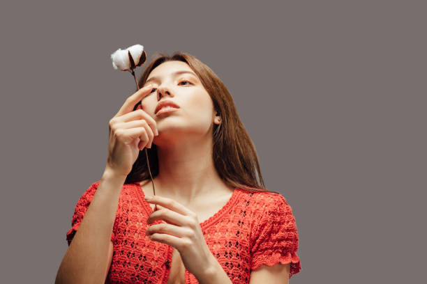 istock Beautiful woman with natural cotton 1082089644