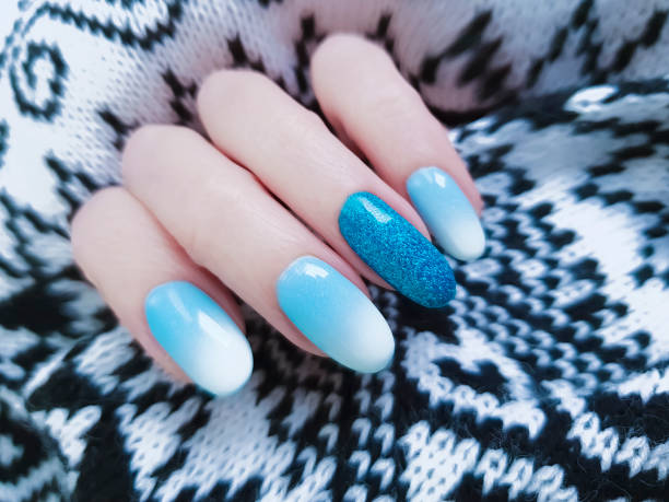 istock female hands beautiful manicure, sweater 1082091672