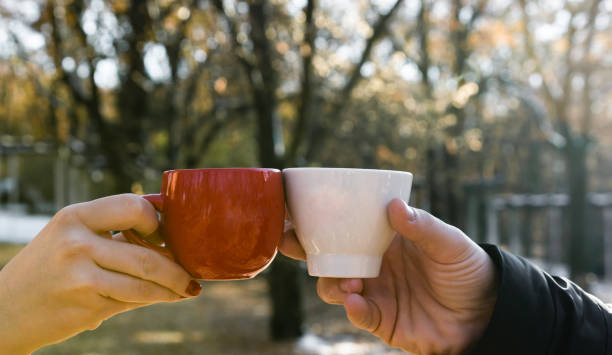 istock Young couple in the park with coffee 1082091876