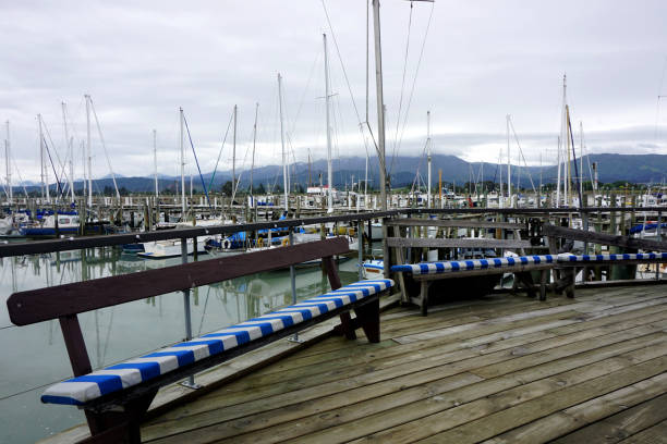 View towards Yachts and Misty Mountains Marina with yachts at Motueka Port, Tasman District, South Island, New Zealand motueka marina tasman region new zealand stock pictures, royalty-free photos & images