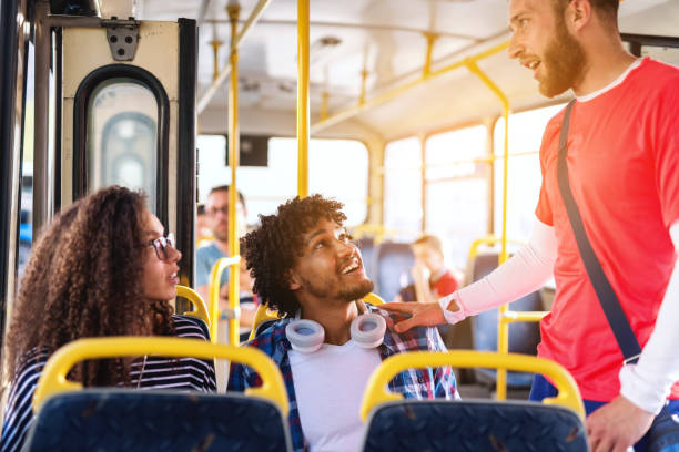 istock Happy multicultural friends talking while driving in the city bus. 1082096226