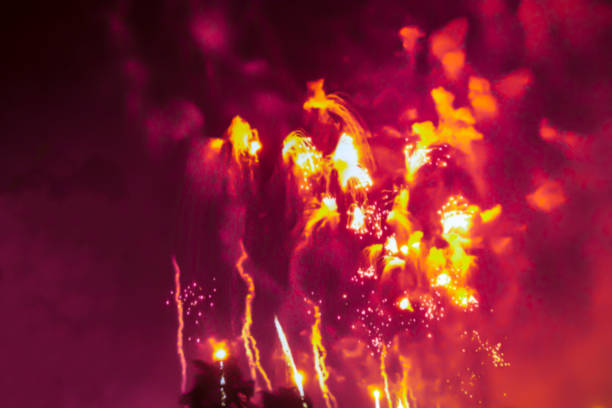 istock red violet  bright blurred fireworks effect abstract colorful background holiday 1082096960