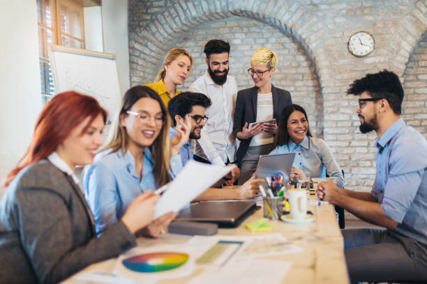 istock Business people working in office together. Team work in office. 1082098028