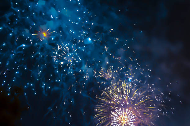 istock blue bright blurred fireworks effect abstract colorful background holiday 1082098488