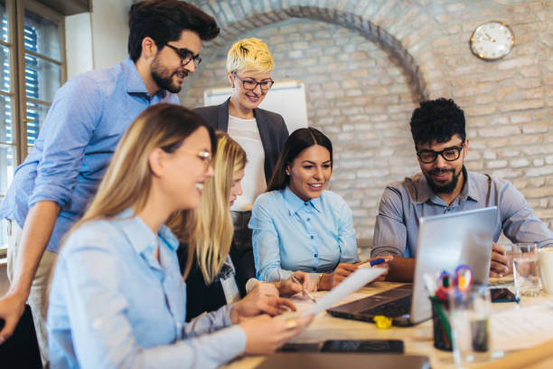 istock Business people working in office together. Team work in office. 1082098756