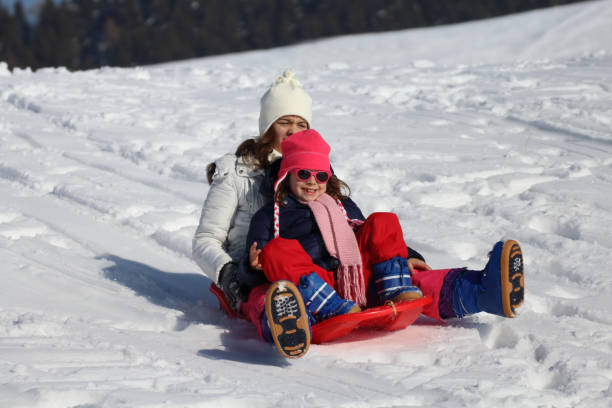 istock little girl sitting inside the sled 1082098904