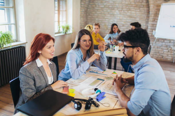 istock Business people working in office together. Team work in office. 1082098936