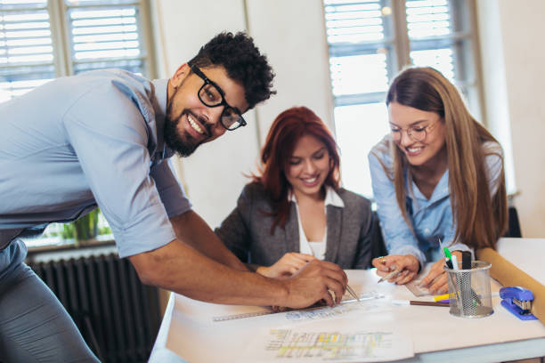 istock Business people working in office together. Team work in office. 1082102196