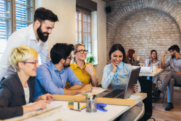 istock Business people working in office together. Team work in office. 1082103528