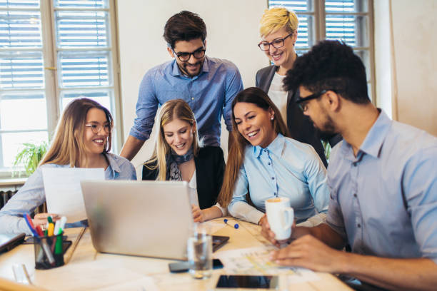 istock Business people working in office together. Team work in office. 1082103794