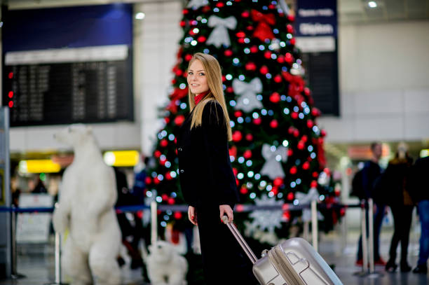 istock Woman with suitcase is going to board on the next flight 1082106578